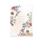 Typoflora greeting card with the 'You're Blooming Lovely!' message and floral design on the front