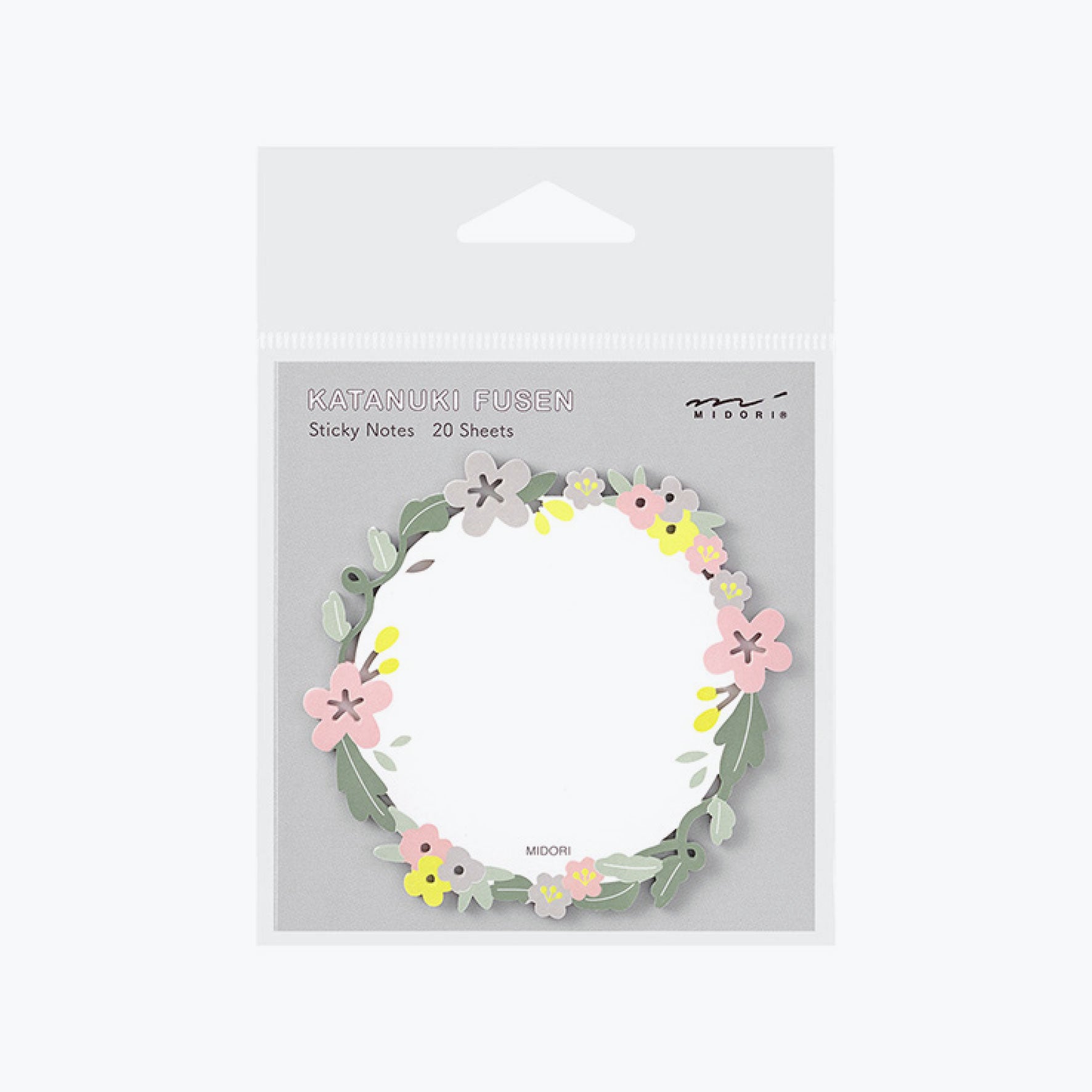 Midori sticky notes in a circular shape decorated with a die-cut floral wreath along the edge