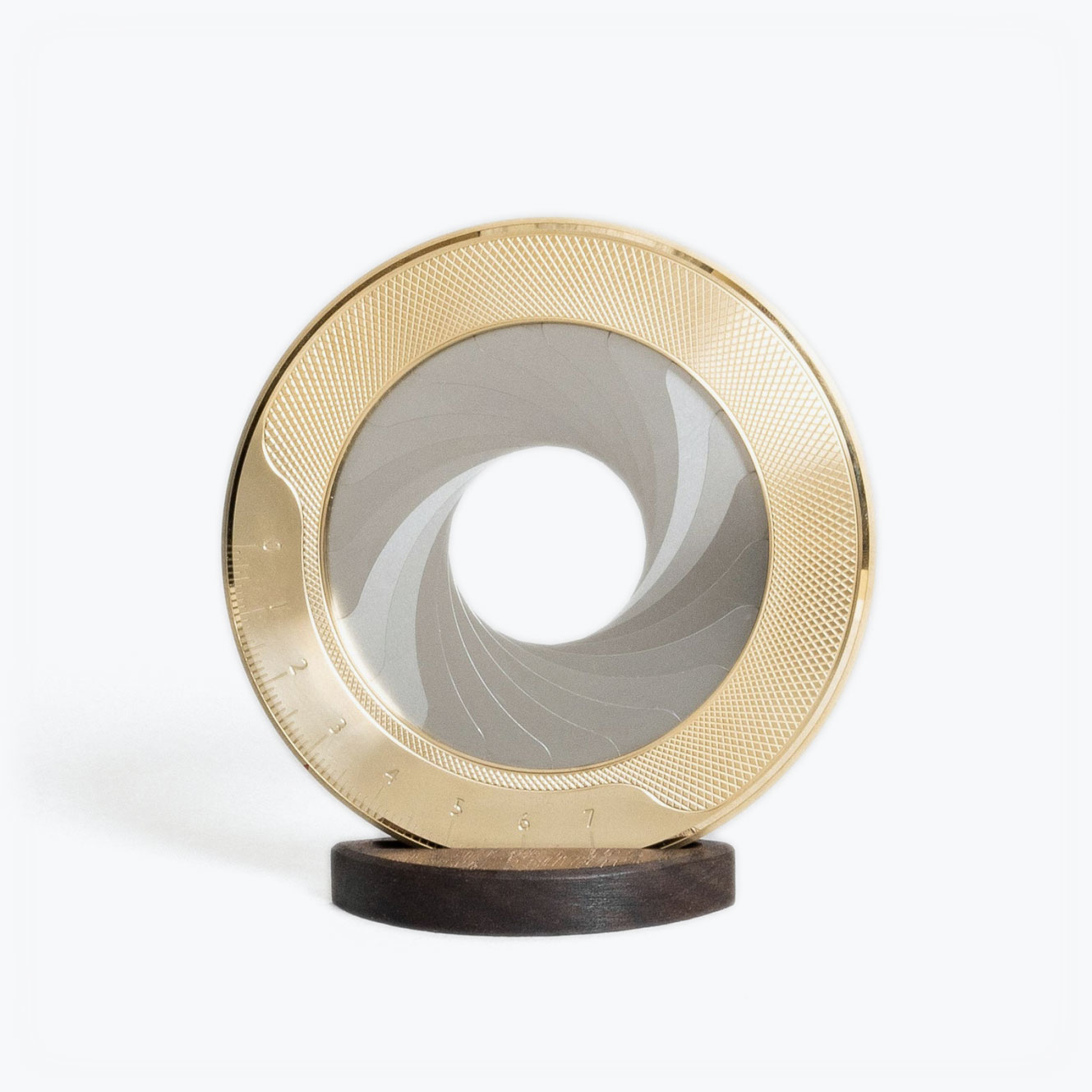 Makers Cabinet Iris drawing compass in solid brass, reimagined from the iris of a camera lens